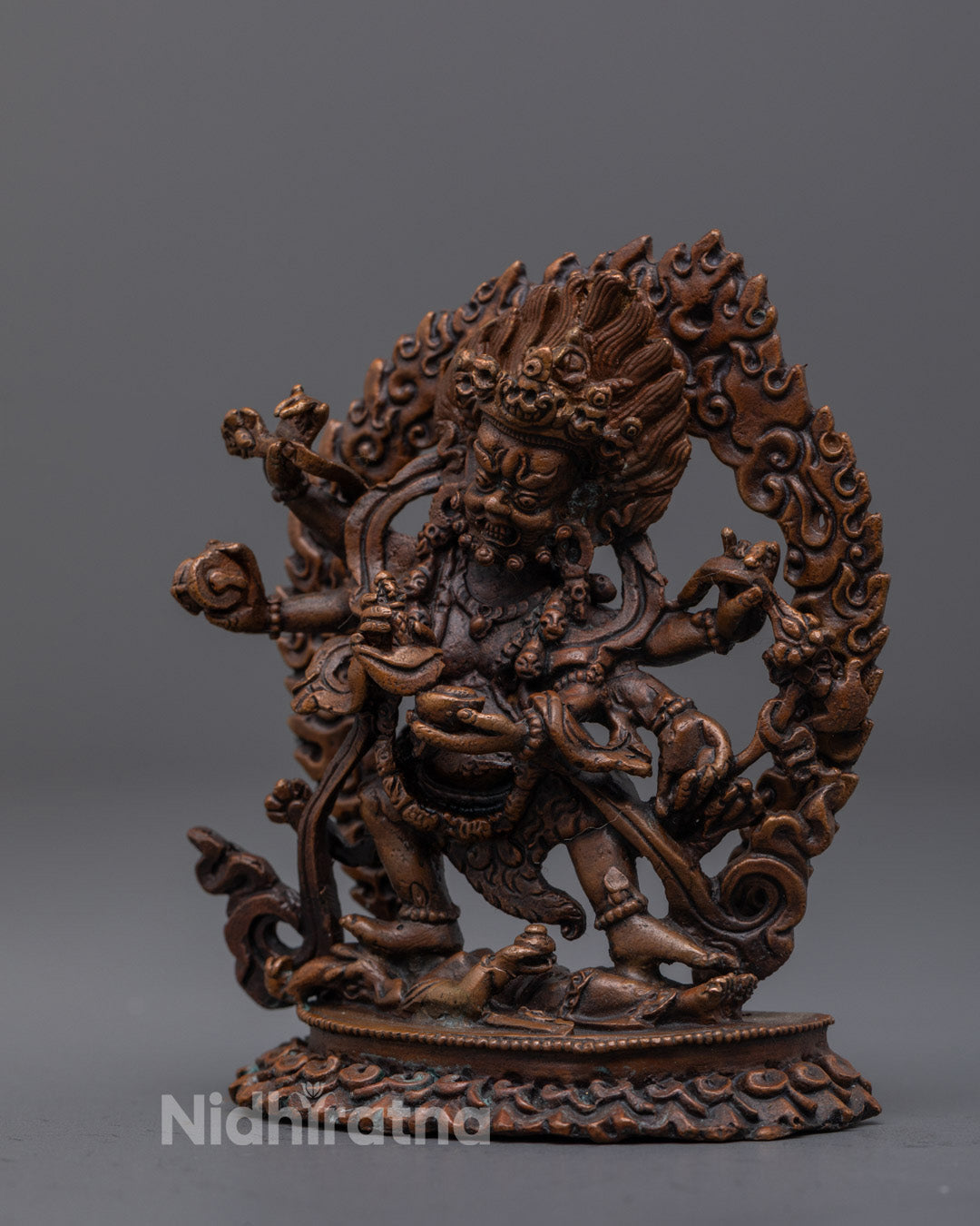 electroplated copper Mahakala statue highlighting curved vajra-handled knife and skull cup