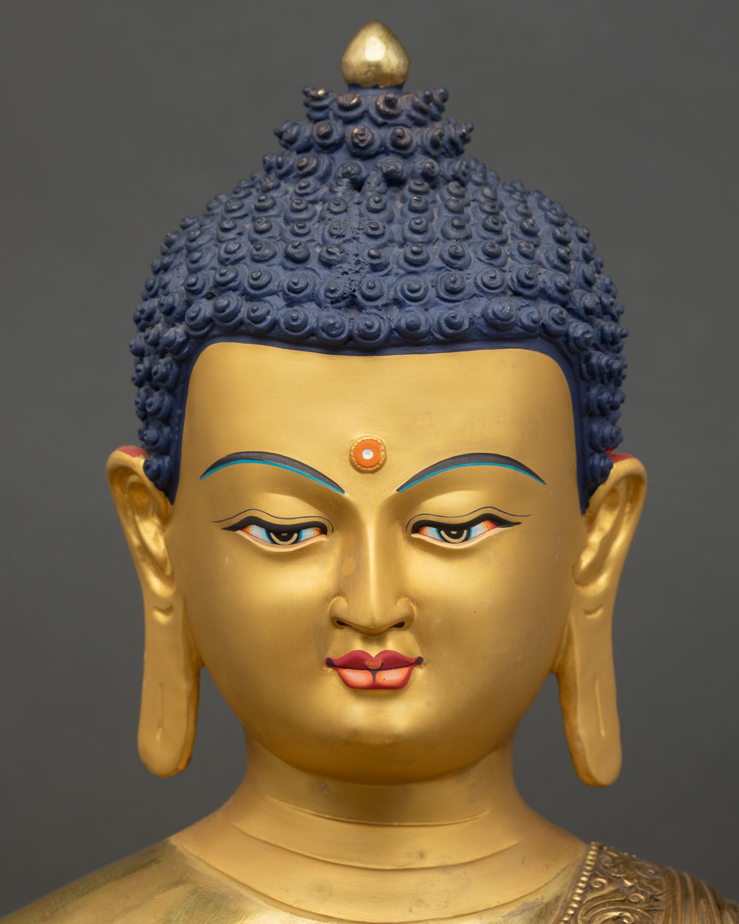 Face close up Amitabha Buddha serene expression gold gilded Nepal Buddhist art
