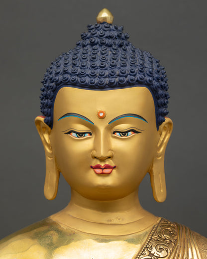 Face close up Medicine Buddha serene expression gold healing Buddha Nepal sculpture art