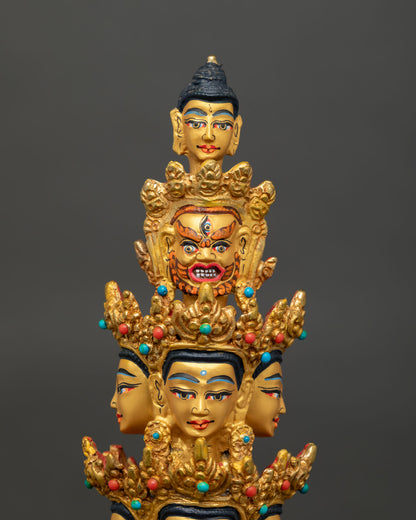 Face close-up of 1000 Armed Chenrezig with eleven heads and 24K gold-painted features