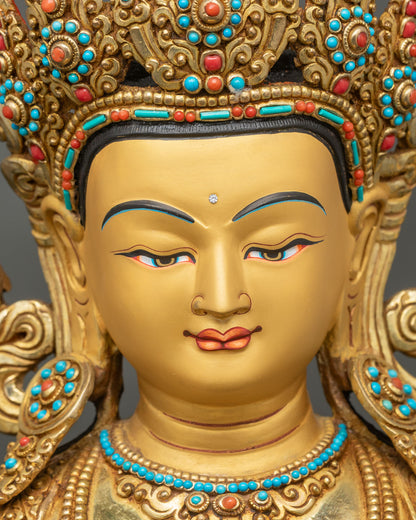 Face close-up of Amitayus Buddha, gold painted expression with serene longevity symbolism