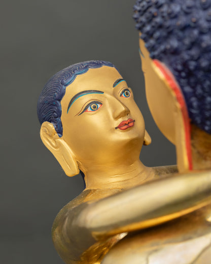 Face Close-Up of Samantabhadra Yab Yum Statue with Serene Gold-Painted Expression