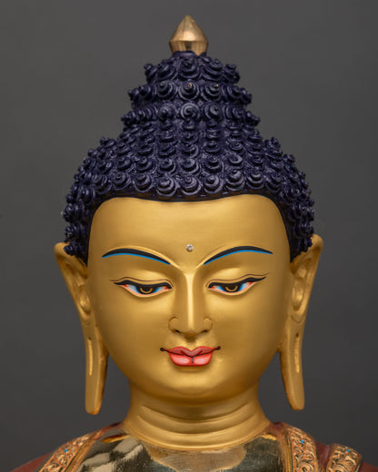 face close up of Shakyamuni Buddha statue, serene expression with 24K gold finish