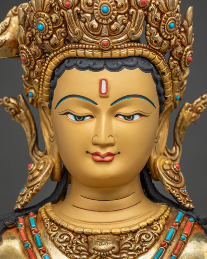 Face of Maha Manjushri statue with hand-painted eyes, jeweled crown and serene expression