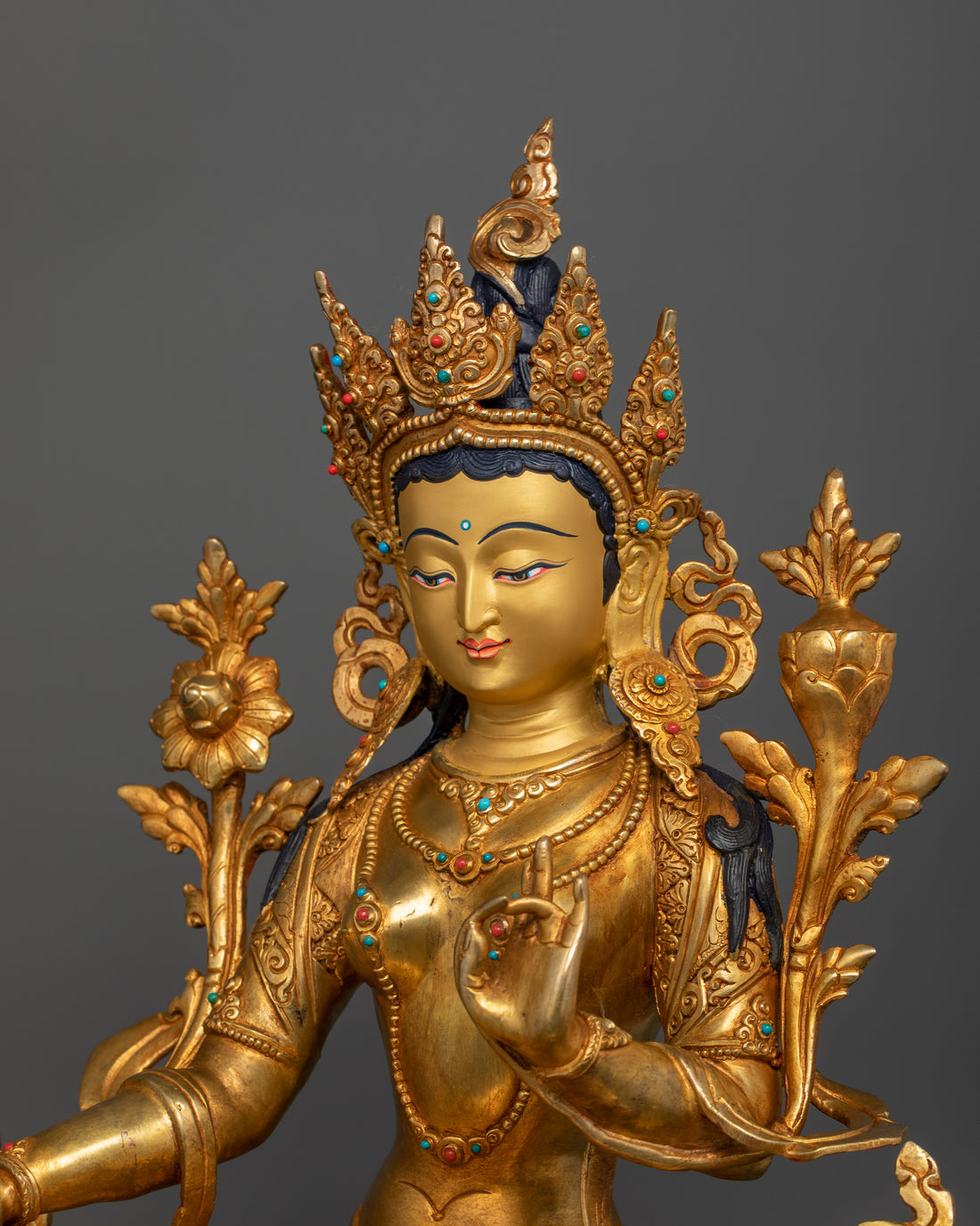 side profile of green tara gold plated statue