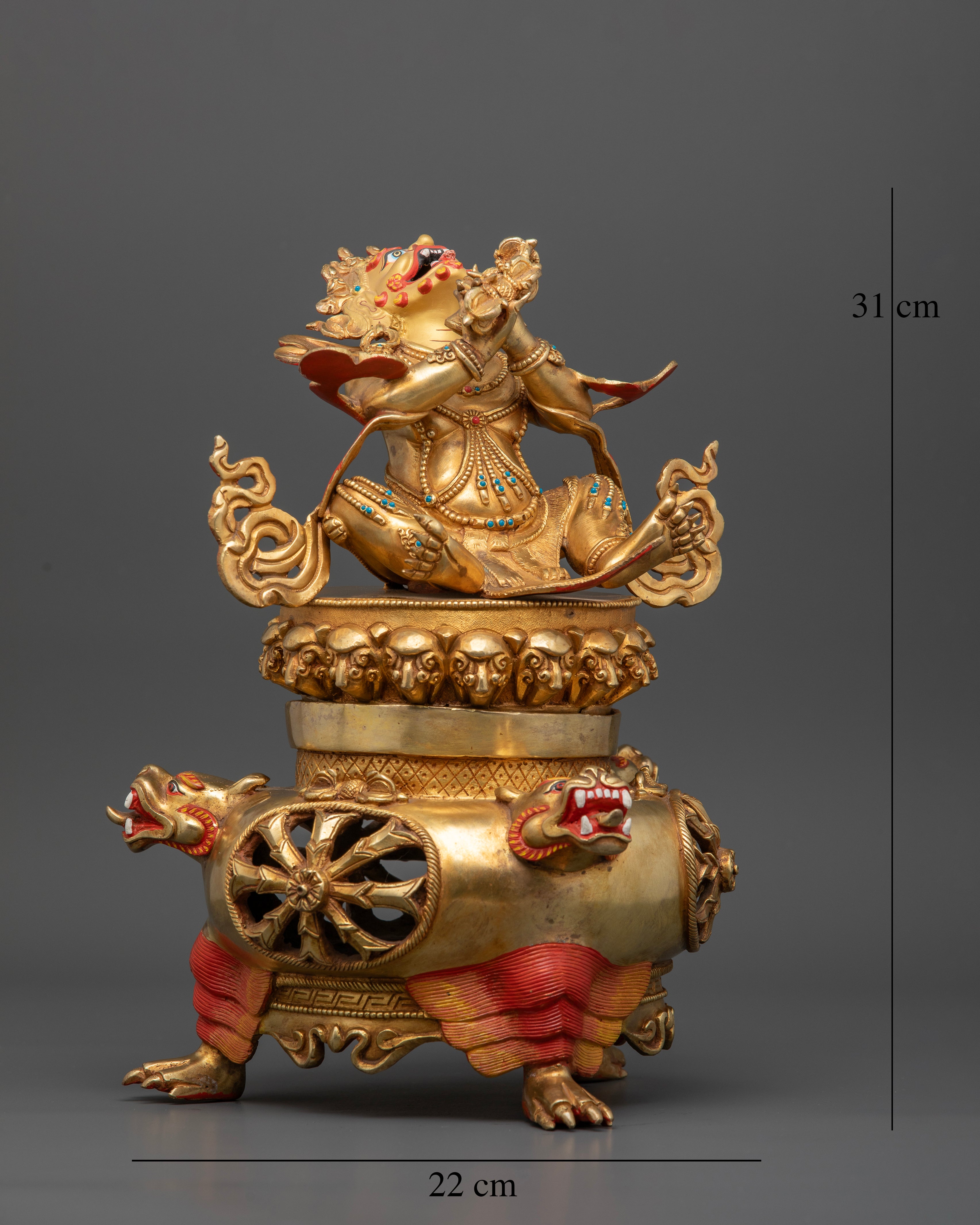 Fierce Vajradhaka statue holding vajra and bell in crossed arms.