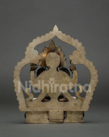 Four-arm Avalokiteshvara statue with crystal rosary, lotus and filigree detailing, copper and stone