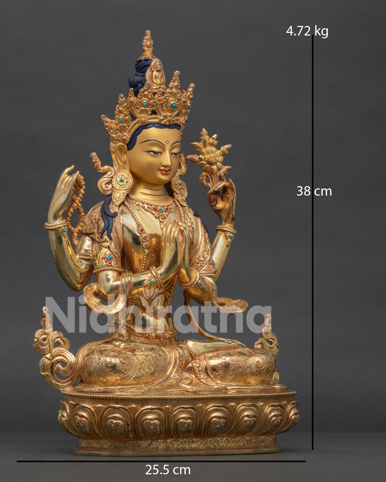 Four-Armed Chenrezig statue, holding sacred Buddhist symbols