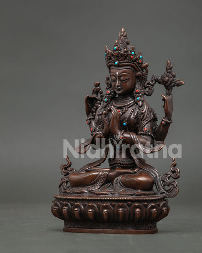 Four arm chenrezig statue seated on lotus pedestal holding jewel mala and utpala flower.
