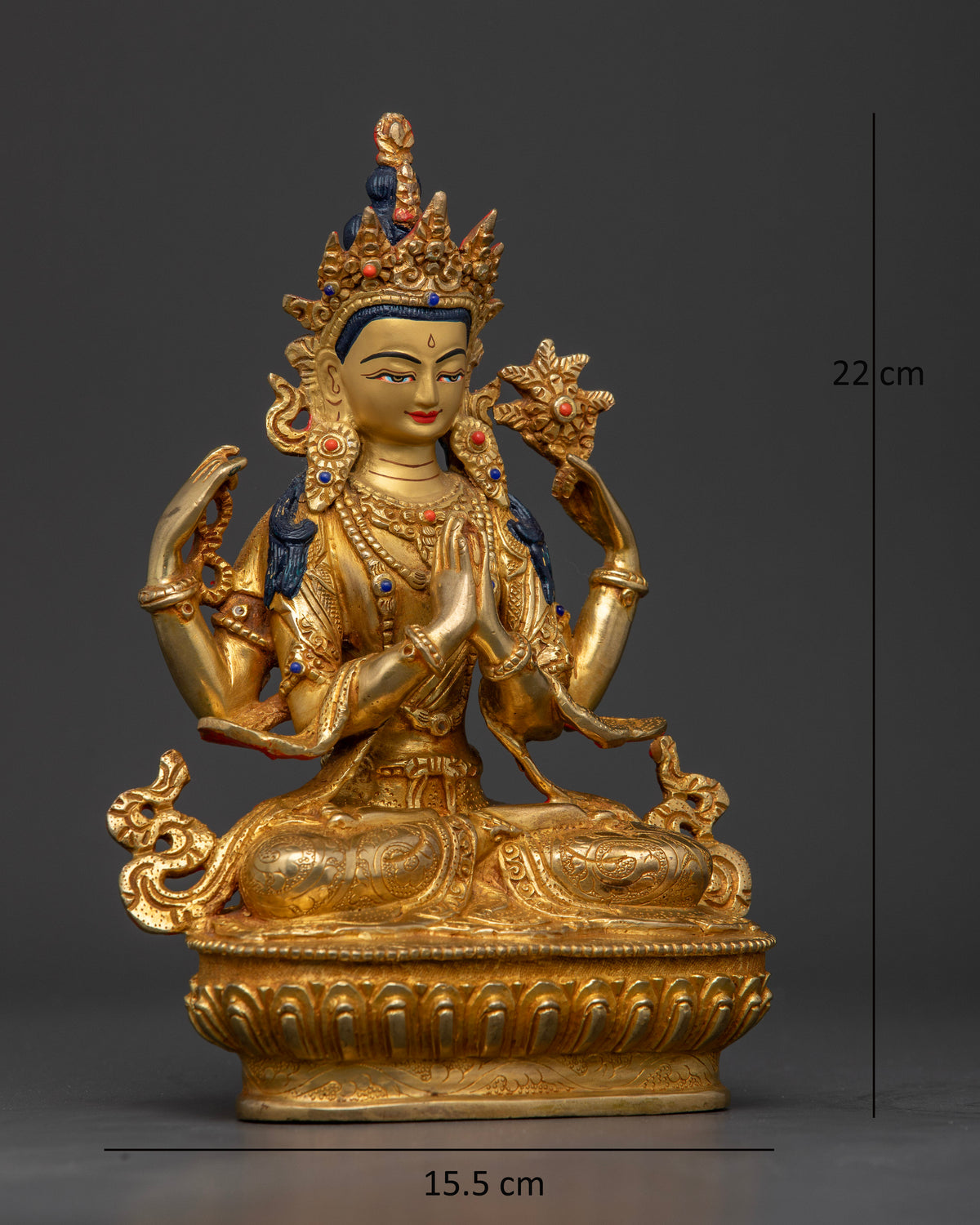 Four-armed Avalokiteshvara seated on a lotus pedestal holding a mala, lotus flower, and wish-fulfilling jewel