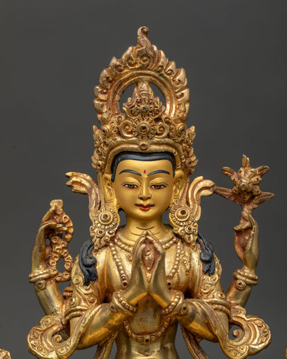 Four Armed Chenrezig Statue 24K Gold Painted Face Close Up.