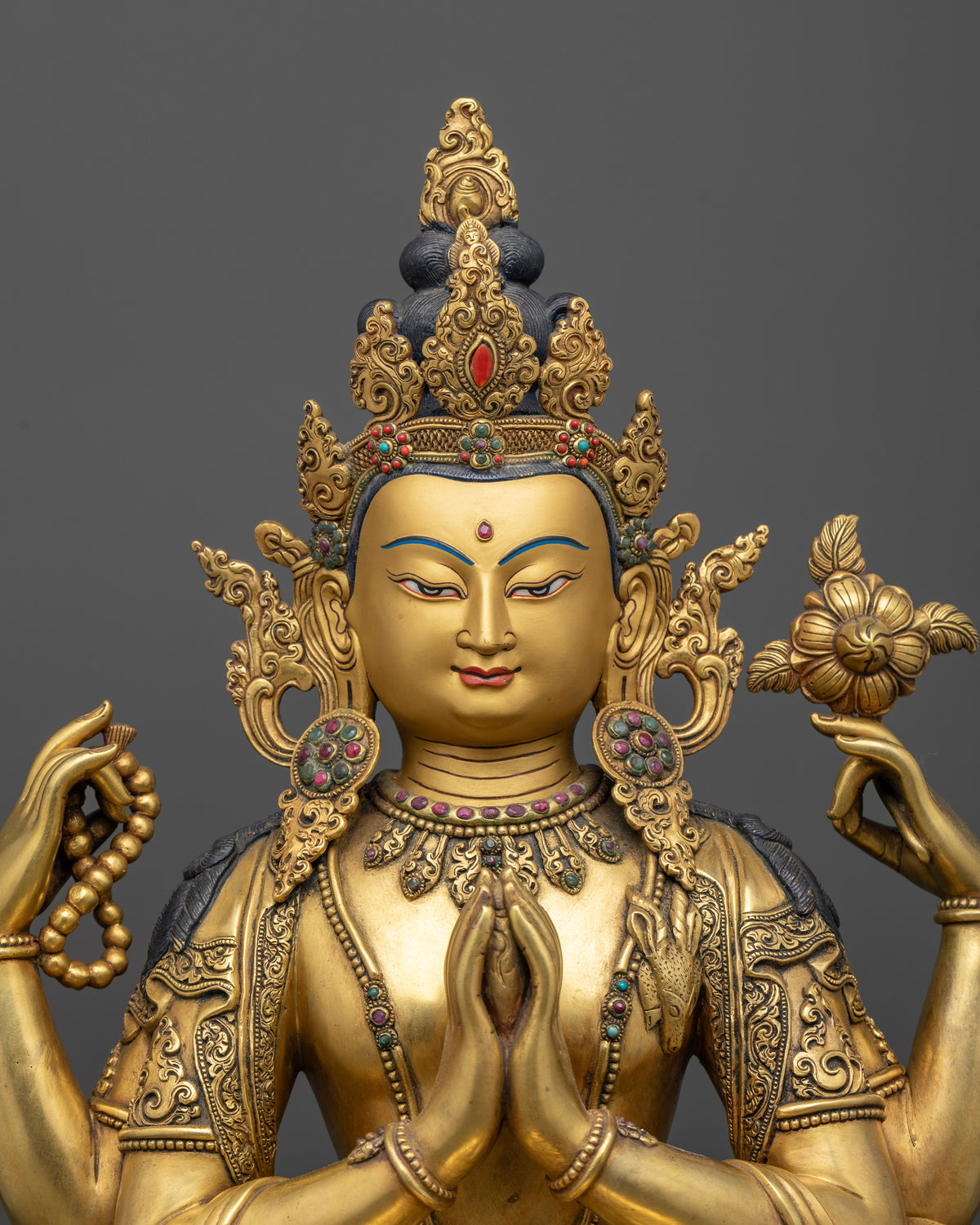 Four-Armed Chenrezig Statue close-up, gold-gilded copper Avalokiteshvara upper body