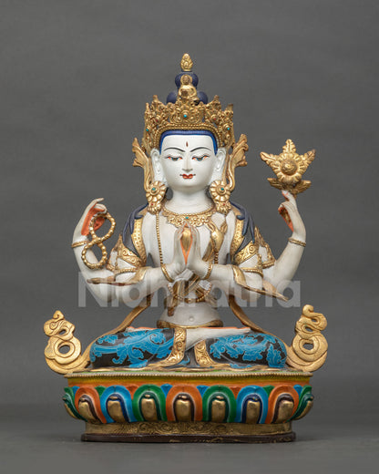 Four-armed Chenrezig statue front view showing a copper Buddhist sculpture with gold-gilded details, semi-precious stones, and a lotus pedestal.