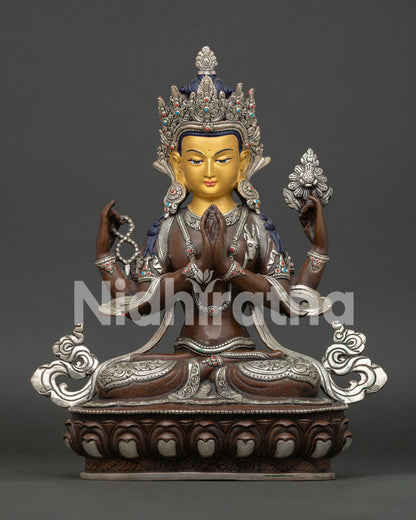 Four-Armed Chenrezig statue holding crystal rosary and lotus, Anjali Mudra with wish-fulfilling jewel.