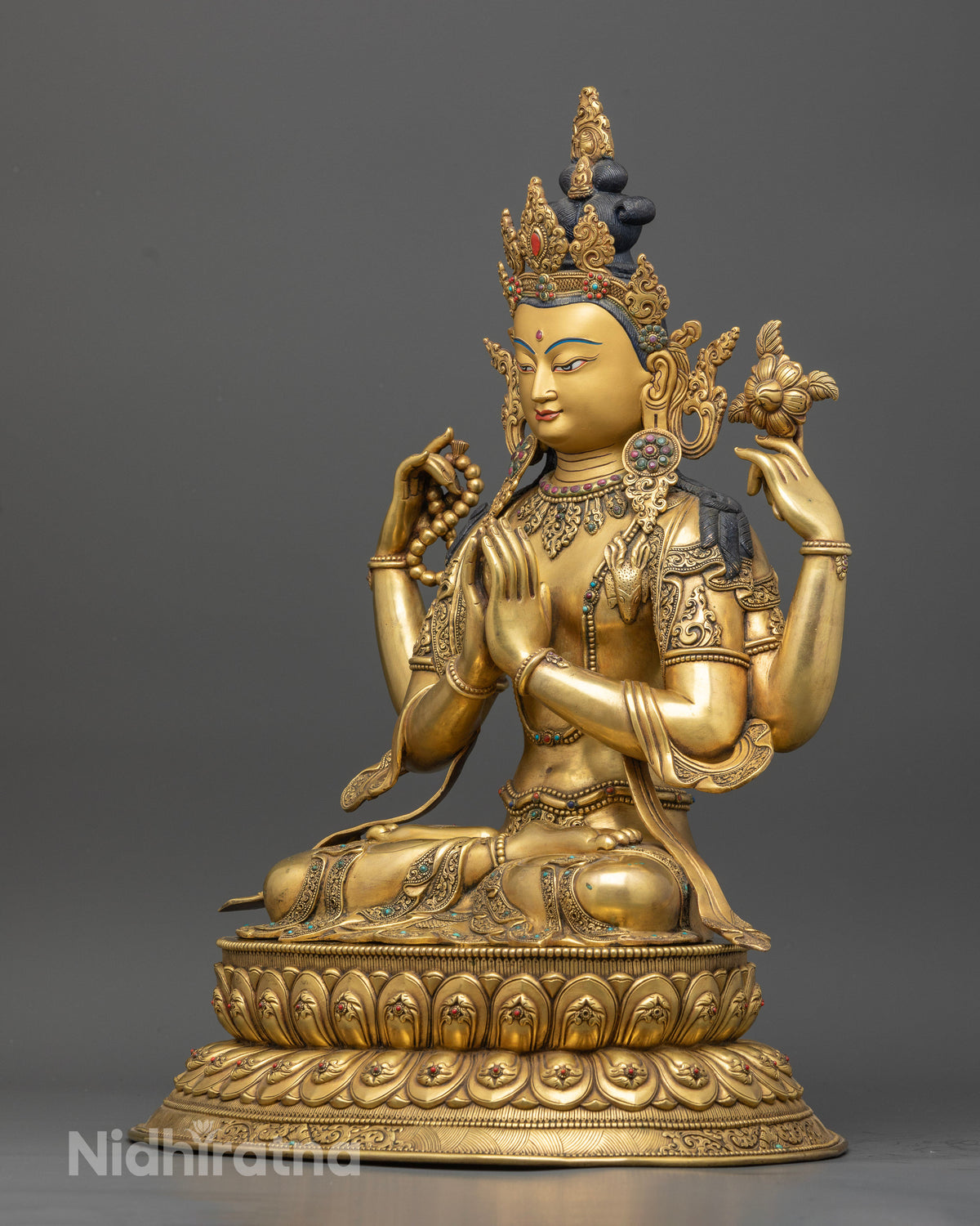 Four-Armed Chenrezig Statue, left side view of handcrafted gold-gilded sculpture