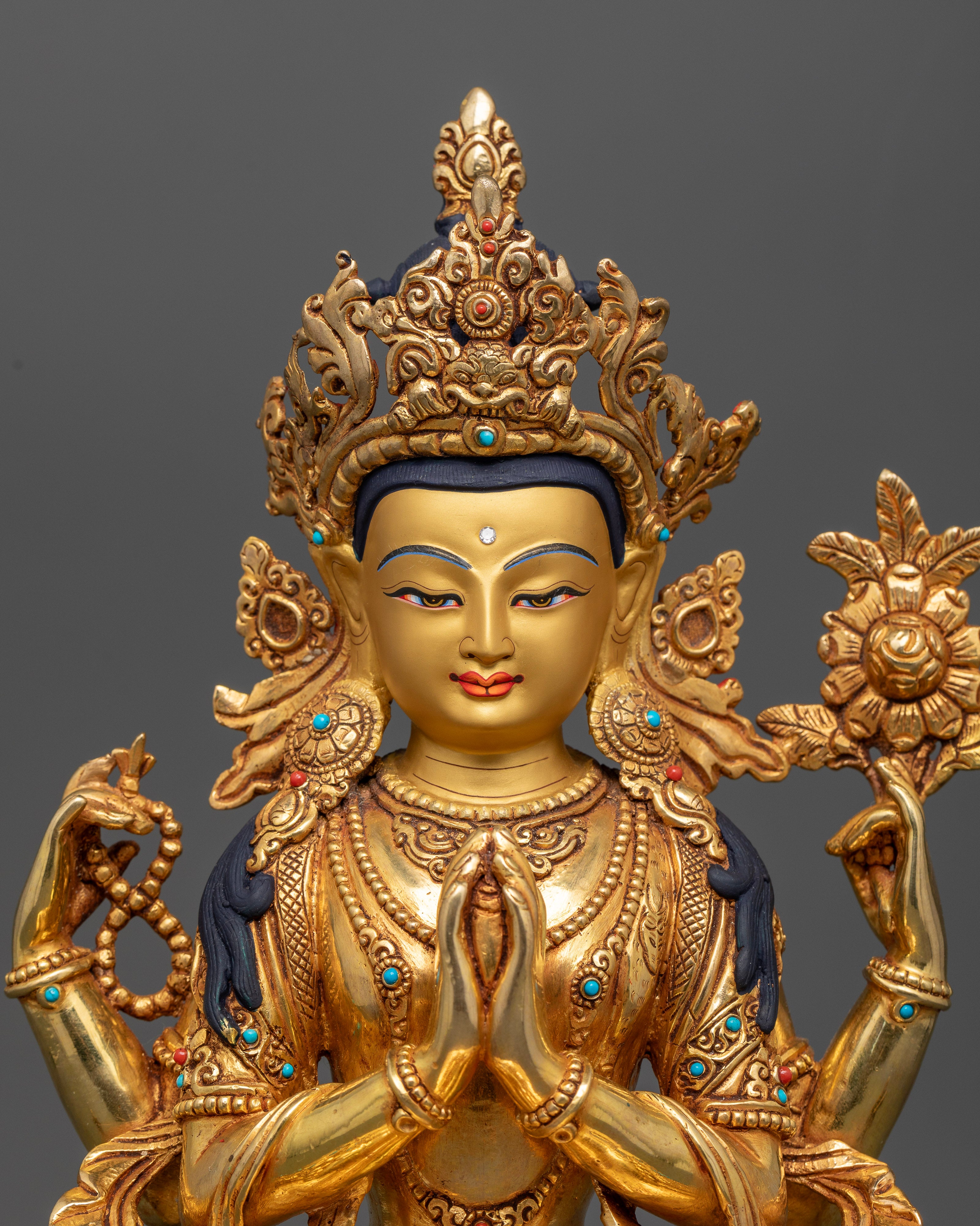 Four-Armed Chenrezig Statue with Crystal Rosary and Blooming Lotus.