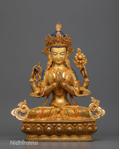 Four armed Chenrezig statue with gold fire gilding and semi precious stones from Nepal