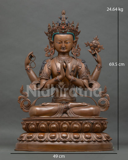 Four-armed copper Chenrezig statue in anjali mudra, holding rosary and lotus, front view