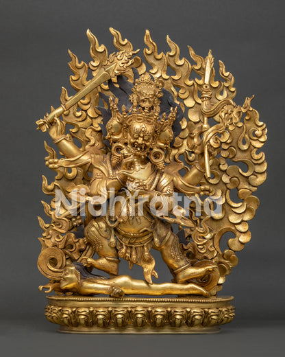 Four-Armed Mahakala Statue front view handcrafted in Nepal with 24K gold fire gilding and gold painted face