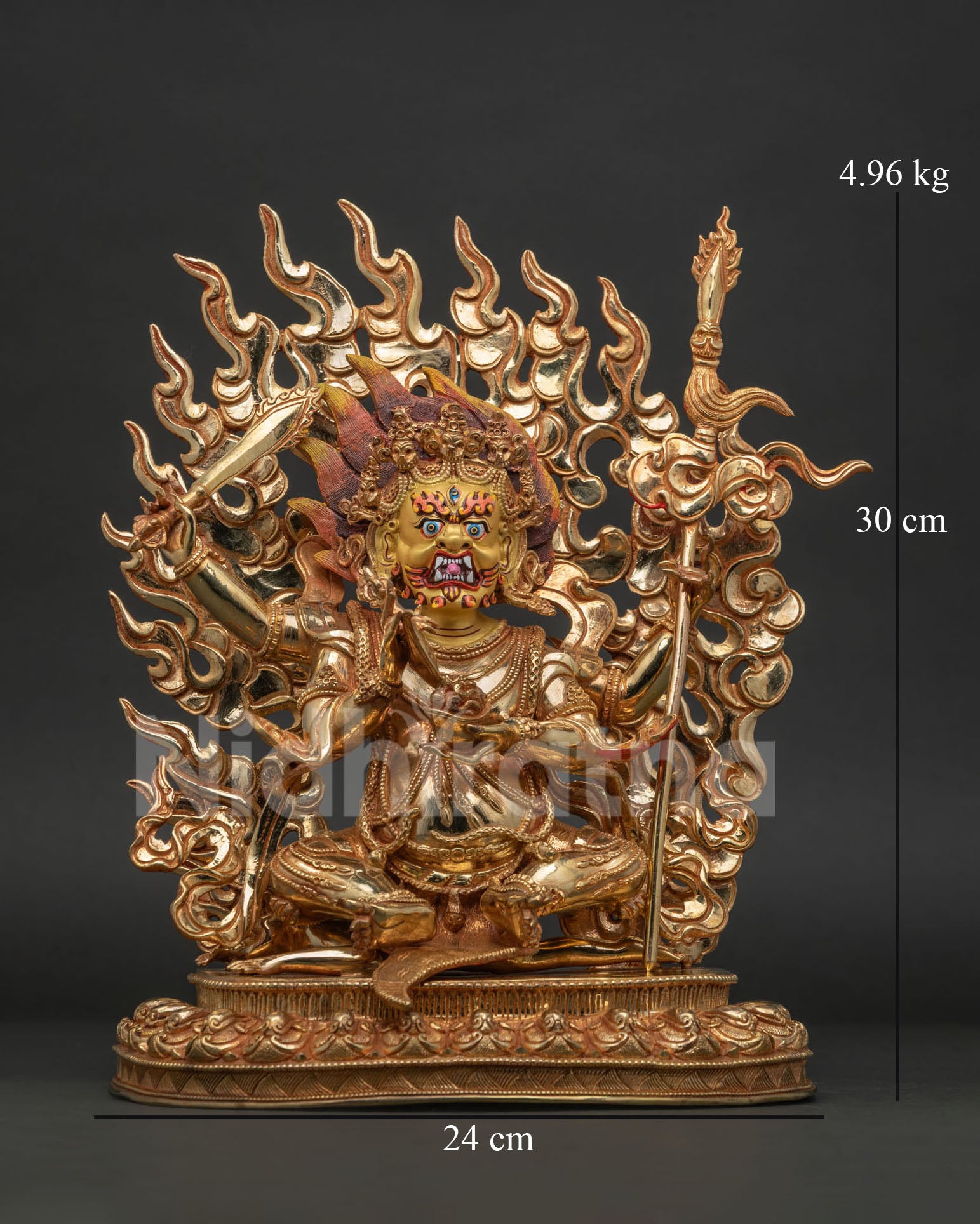 Four-Armed Mahakala statue handcrafted in gold gilded copper from Patan Nepal.