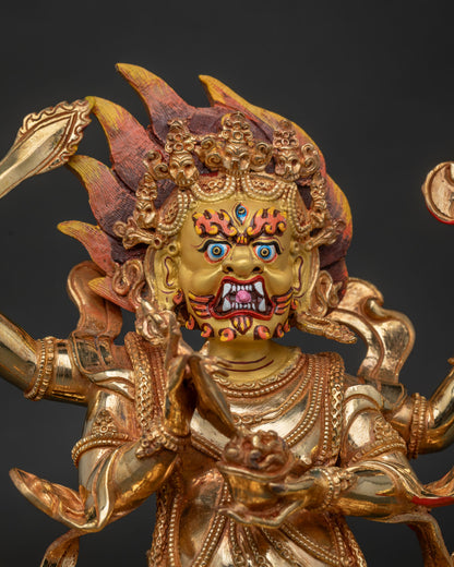 Four-Armed Mahakala statue with 24K gold painted face and blazing halo.