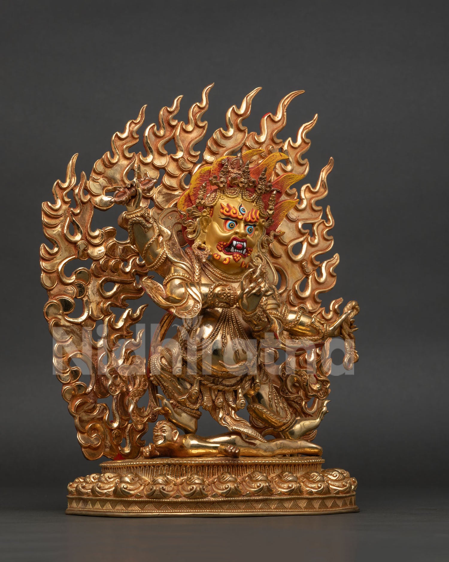 Four Armed Vajrapani Statue Close Up 24K Gold Painted Face and Wrathful Expression.