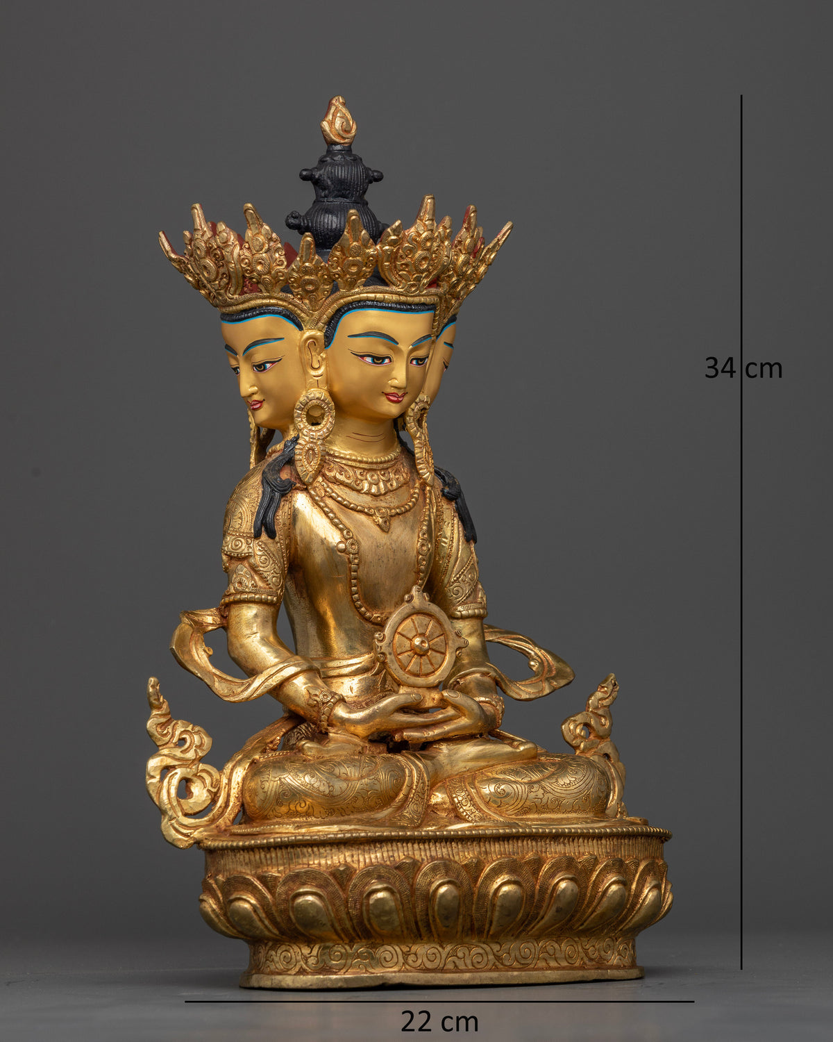 Four-faced Vairocana Buddha sculpture, seated on a lotus pedestal with traditional Newari carvings