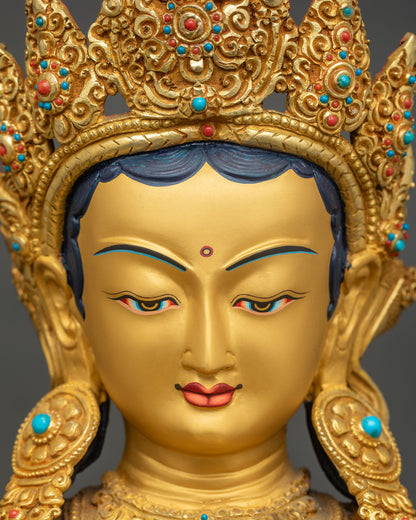Front close-up of the serene Green Tara face and jeweled crown on a handcrafted Newari gold gilded statue