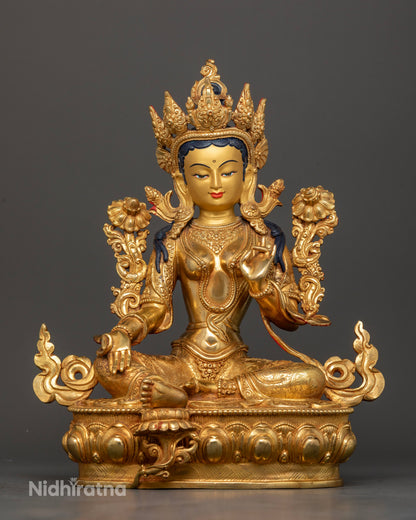 front view of Green Tara statue handcrafted Nepal gold painted face lotus pedestal Buddhist goddess