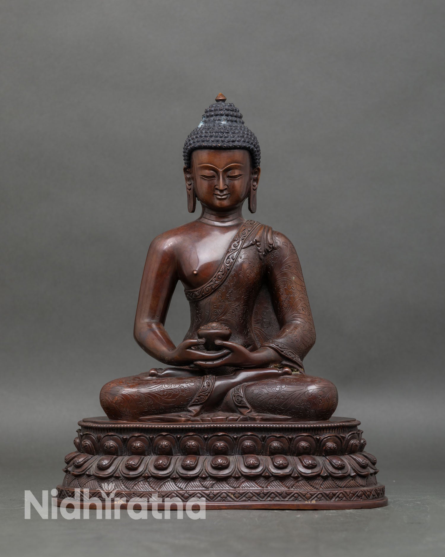 Front view of Amitabha Buddha statue handcrafted from oxidized copper