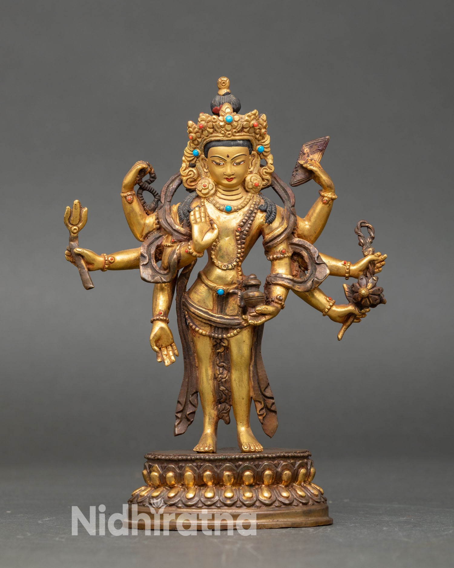 Front view of Amoghapasa Lokeshvara statue handmade copper Buddhist sculpture from Nepal gold gilded oxidized finish lost wax casting multi armed deity