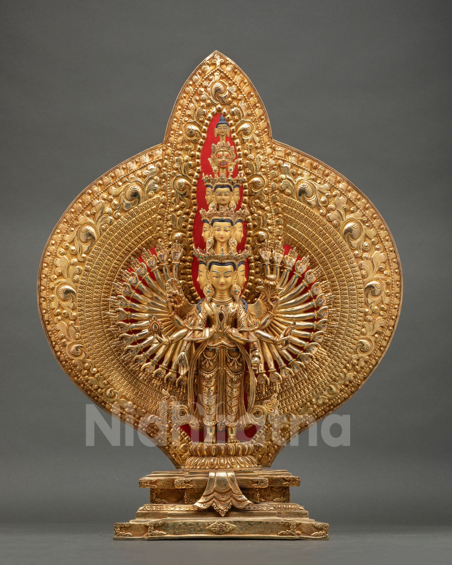 Front view of Avalokiteshvara Thousand Armed statue with 24K gold gilding fire gilded finish and copper craftsmanship Nepal