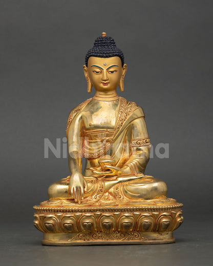 Front view of Buddha Shakyamuni Statue handcrafted in copper with gold detailing lost wax casting Nepal Buddhist art lotus pedestal meditation decor