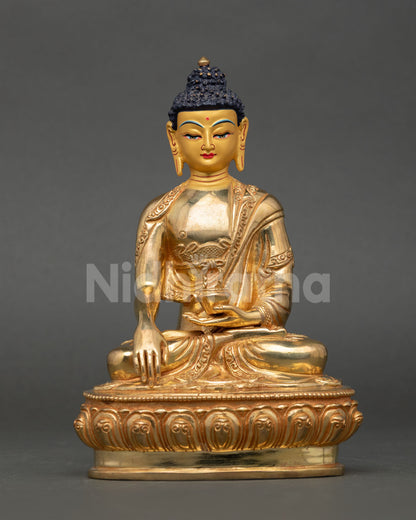 Front view of Buddha Shakyamuni Statue handcrafted in copper with gold gilded finish from Nepal for meditation and spiritual decor