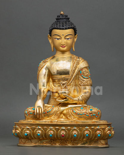 Front view of Buddha Shakyamuni statue with gold gilding Earth Touching Mudra handmade Nepal copper sculpture for meditation and altar decor
