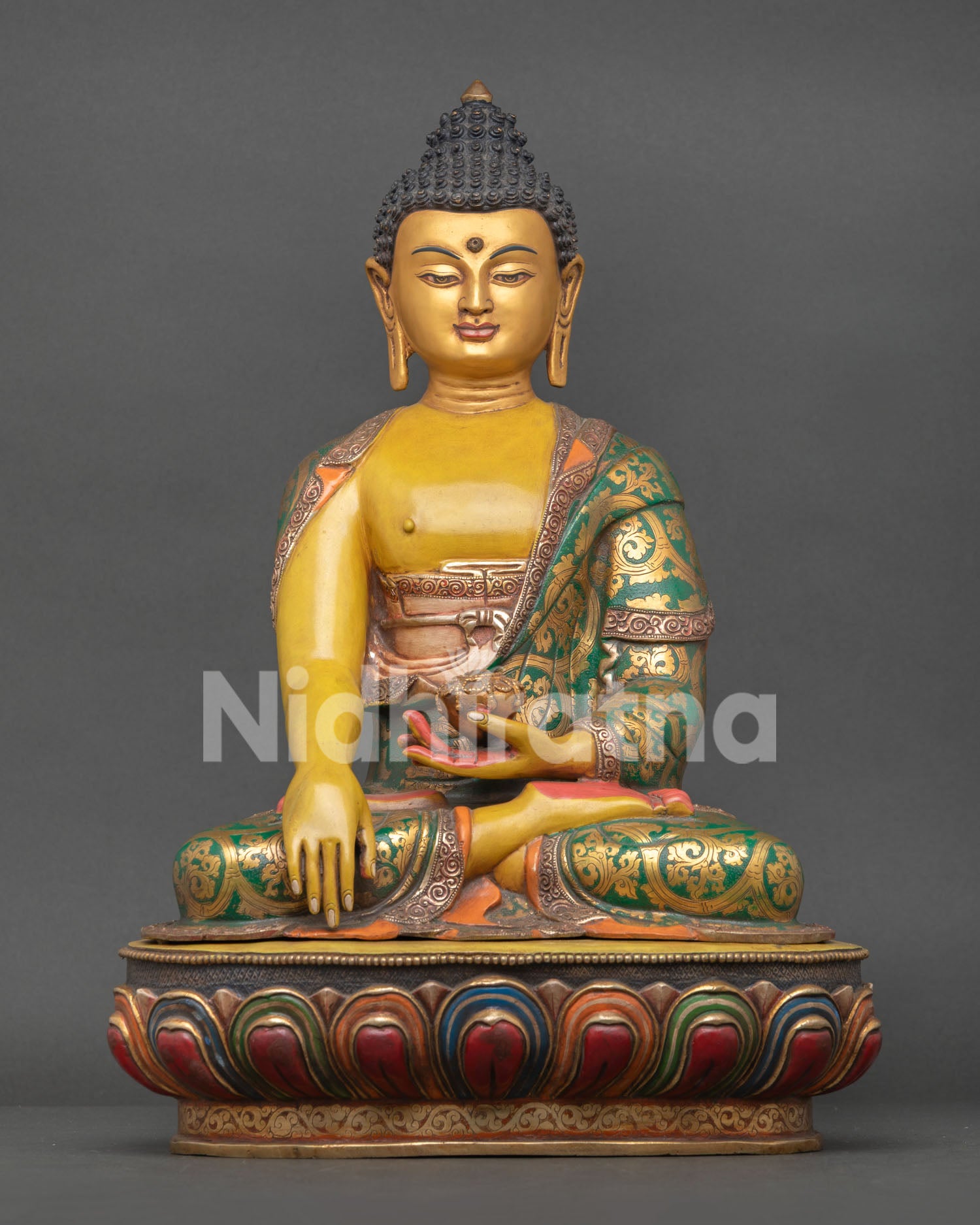 Front view of Buddha Shakyamuni statue with yellow hued body and gold painted face