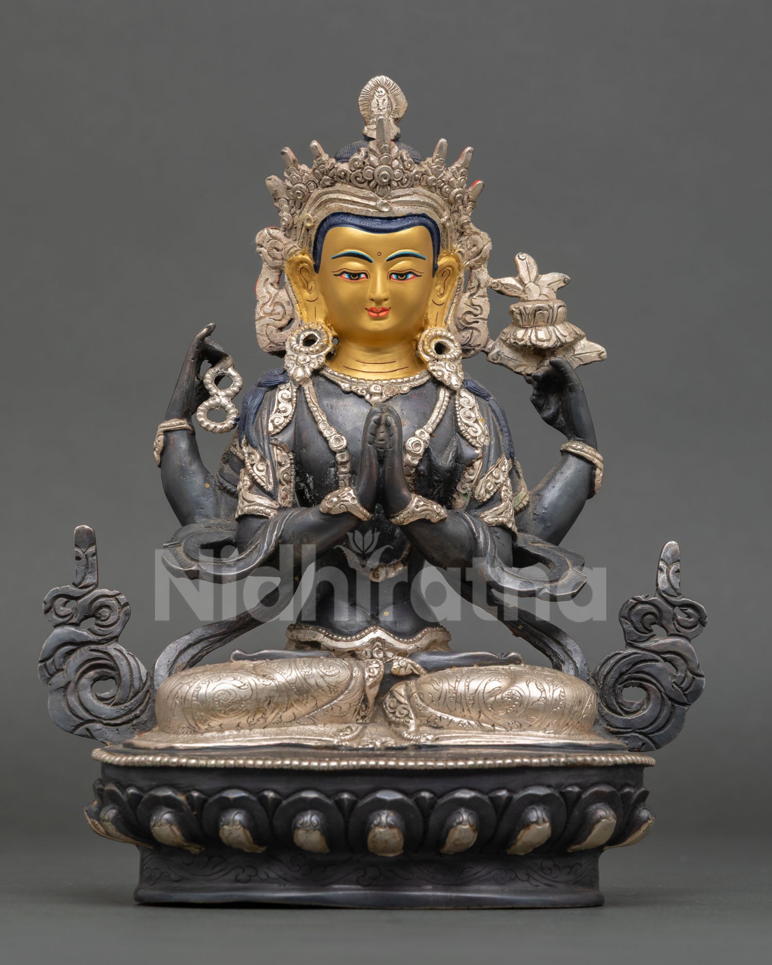 Front view of Chenrezig statue, featuring a gold-painted face seated on a lotus pedestal for a Buddhist altar and meditation decor.