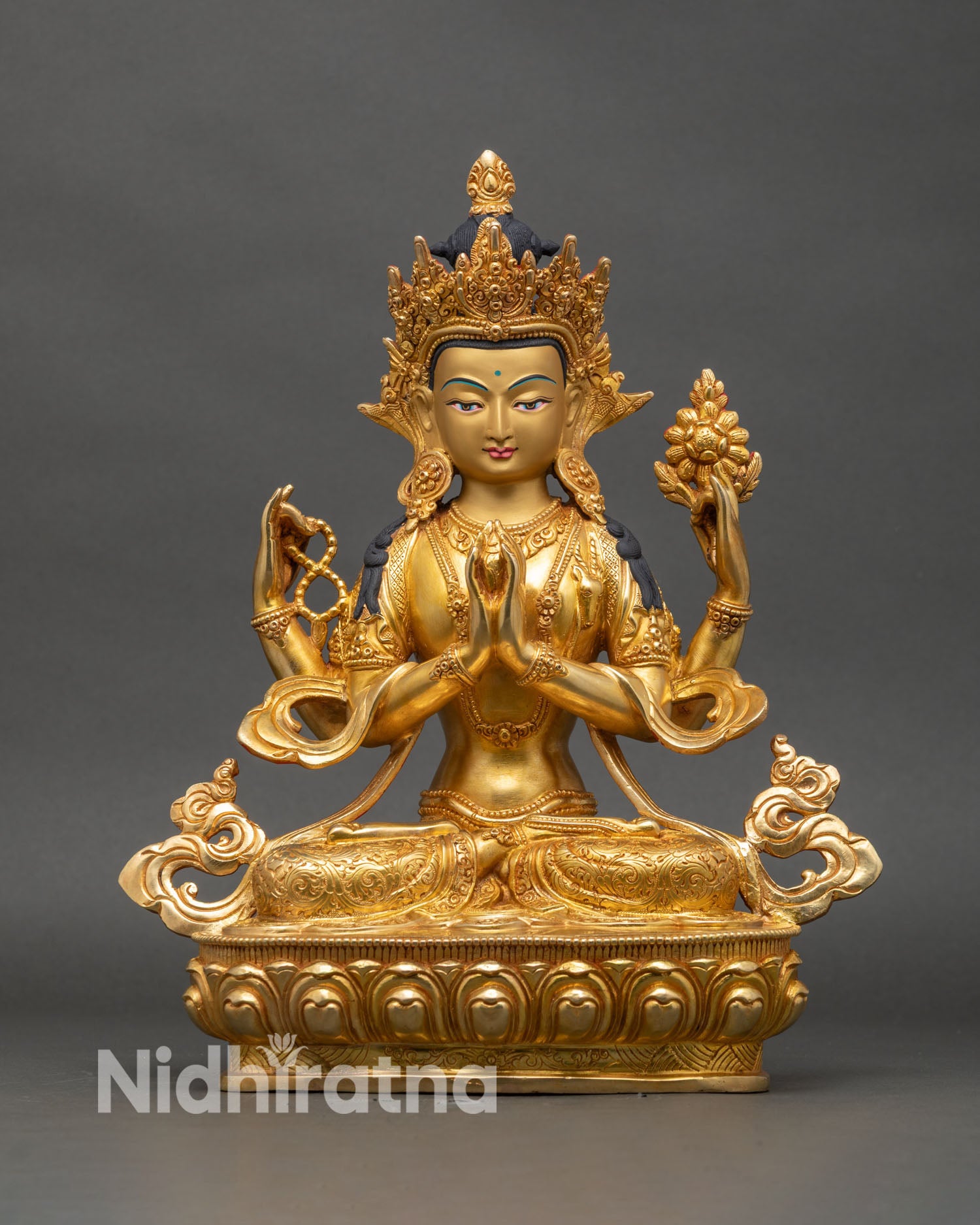 Front view Chenrezig statue four armed gold-gilded copper handcrafted Nepal