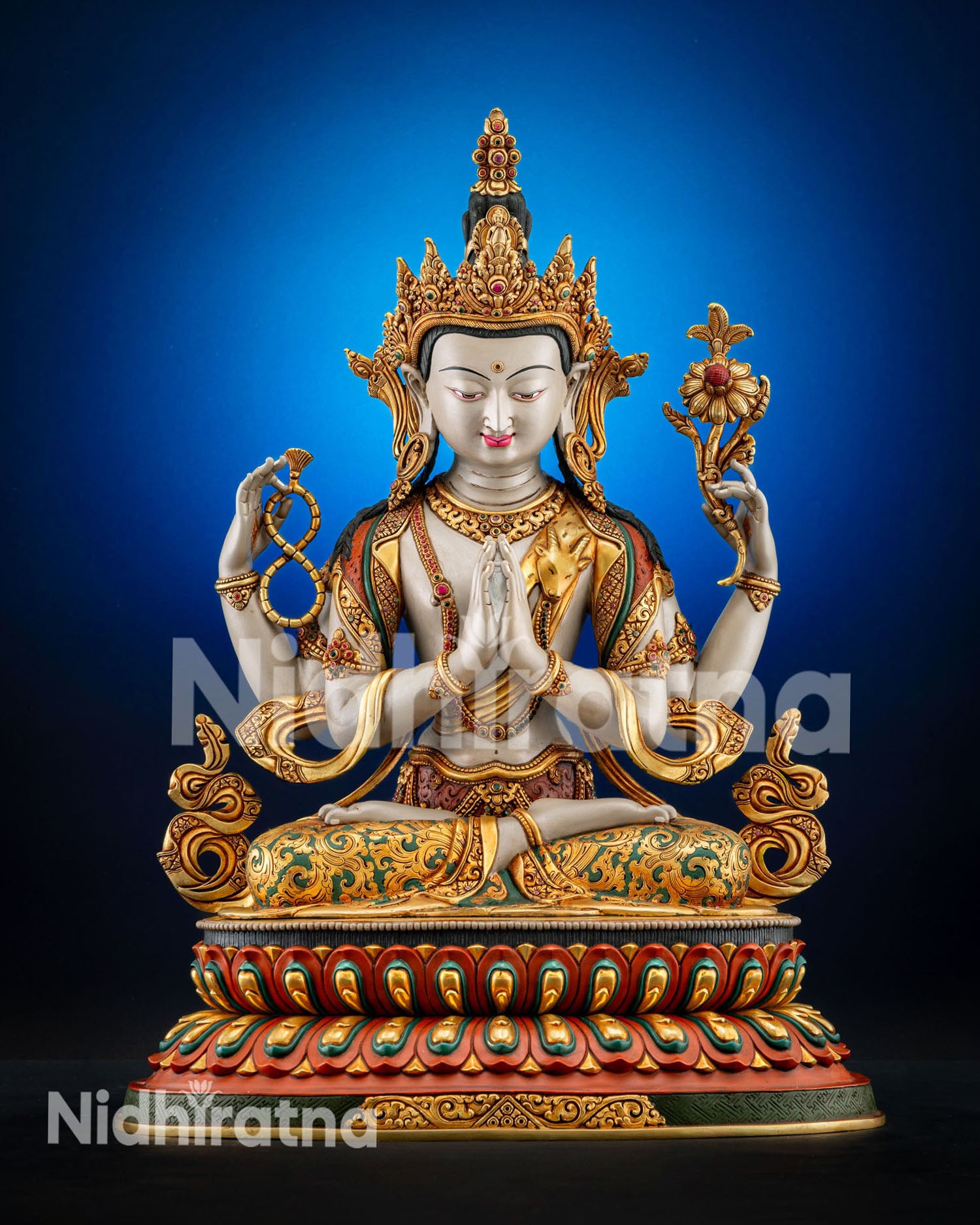 Front view Chenrezig statue handcrafted in copper with white hued body 24K gold fire gilding and hand painted details from Kathmandu Nepal