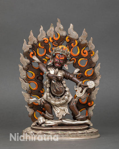 Front view of Drogdze Wangmo statue handmade copper Buddhist protector deity from Nepal oxidized silver plated finish semi precious stones blazing halo