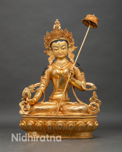 Front view of Dukar statue, handcrafted Nepalese copper with gold fire-gilded details