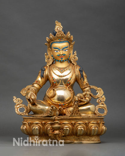 Front view Dzambhala statue, copper and gold fire-gilded Nepalese wealth deity