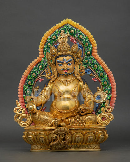 Front view of Dzambhala statue handcrafted in copper with gold gilding seated on lotus pedestal with halo for Buddhist altar