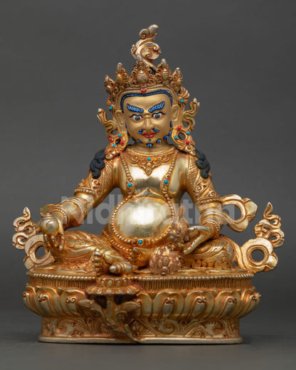 Front view Dzambhala Statue handmade by Newari artist cast in copper with gold painted face wealth deity sculpture