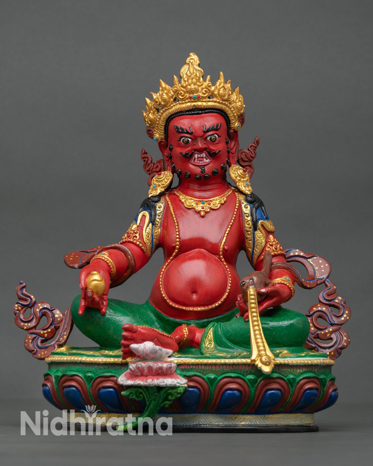 Front view of Dzambhala statue, seated on lotus pedestal in royal ease posture with gold gilded finish and acrylic painted details 