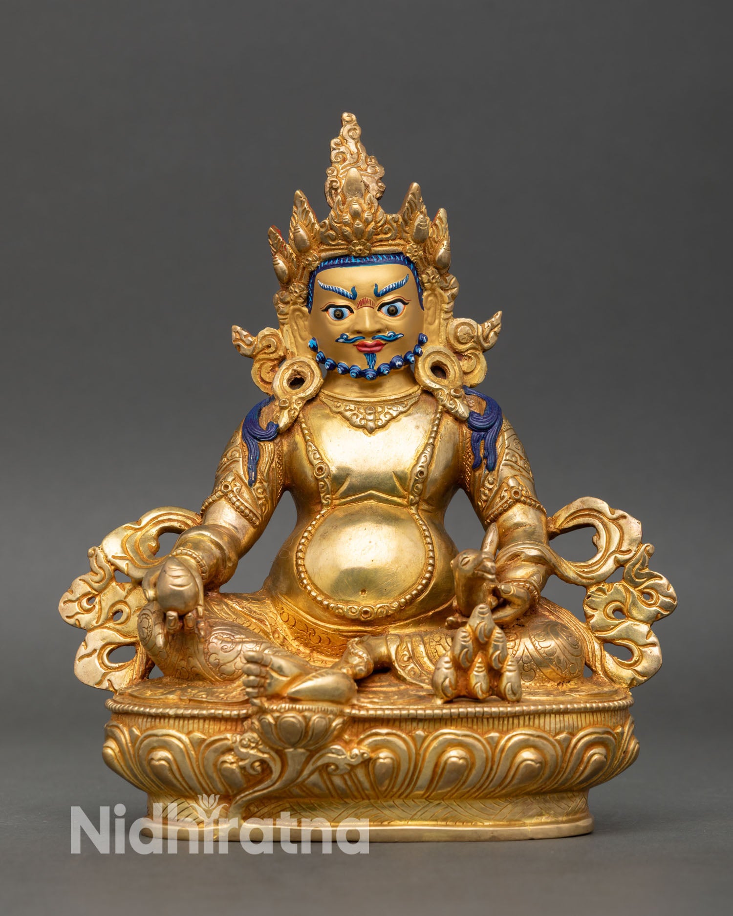 Front view of Dzambhala statue Nepal copper gold fire gilded wealth deity seated lotus pedestal 