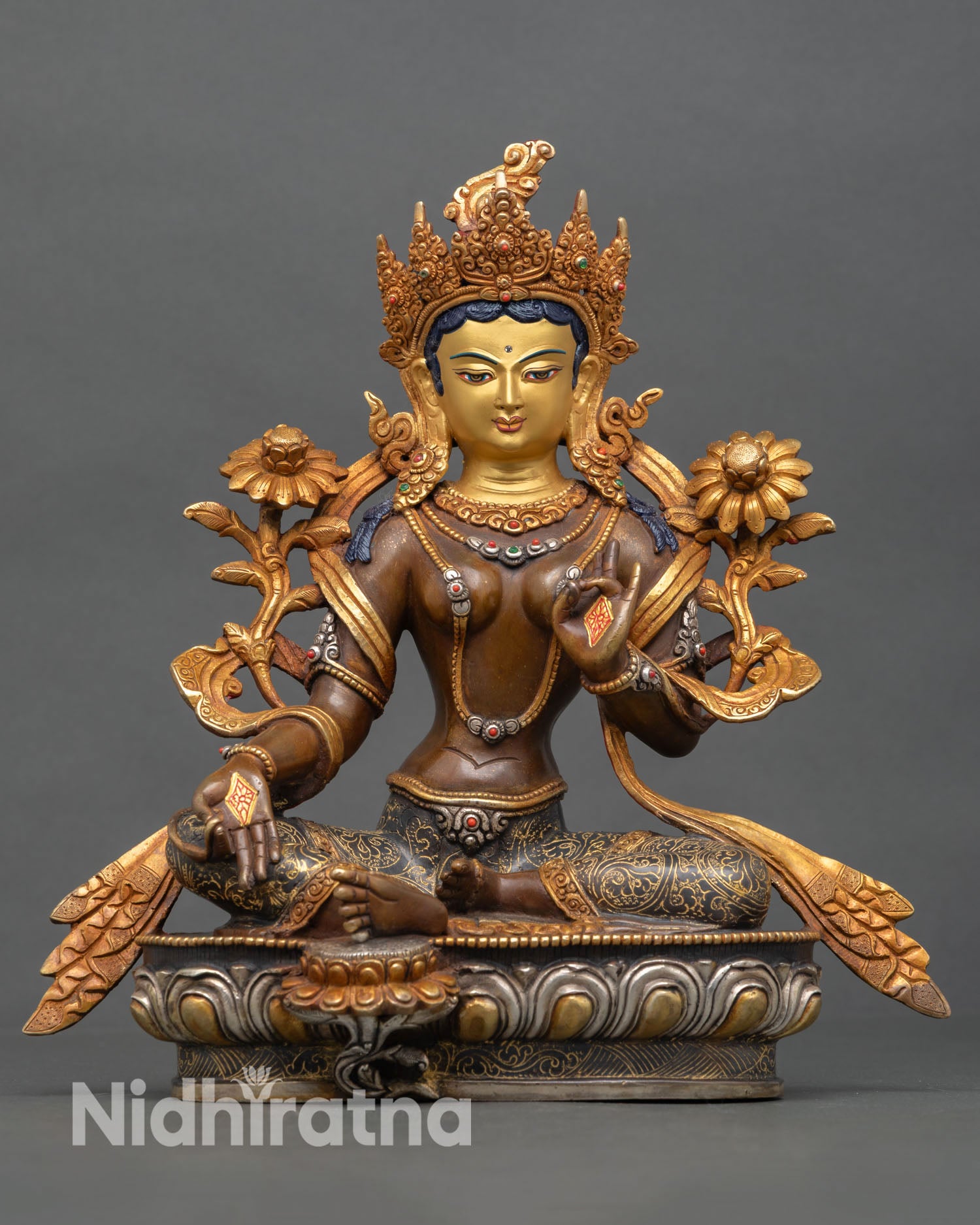 Front view of Green Tara statue, copper oxidized finish, gold painted face, semi precious stones, lotus pedestal altar sculpture, Nepal craftsmanship