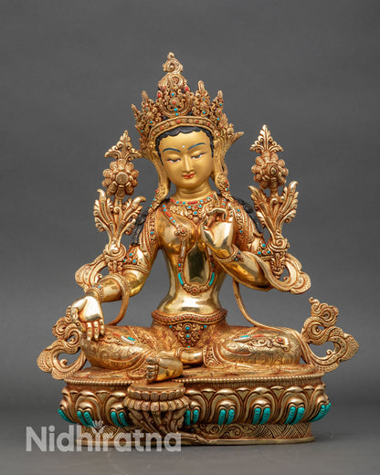 Front view Green Tara statue gold gilded copper lotus pedestal Patan Nepal
