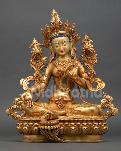 Front view of Green Tara statue handcrafted by Newari artisan from Patan Nepal premium copper 24K gold fire gilded gold painted face semi precious stone inlay