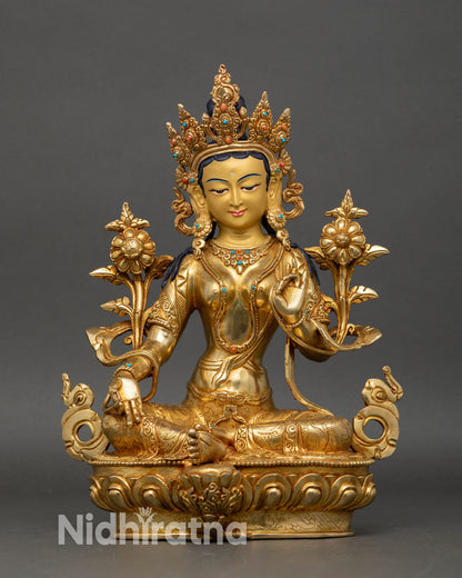 Front view of Green Tara statue handcrafted copper gold painted face lotus pedestal